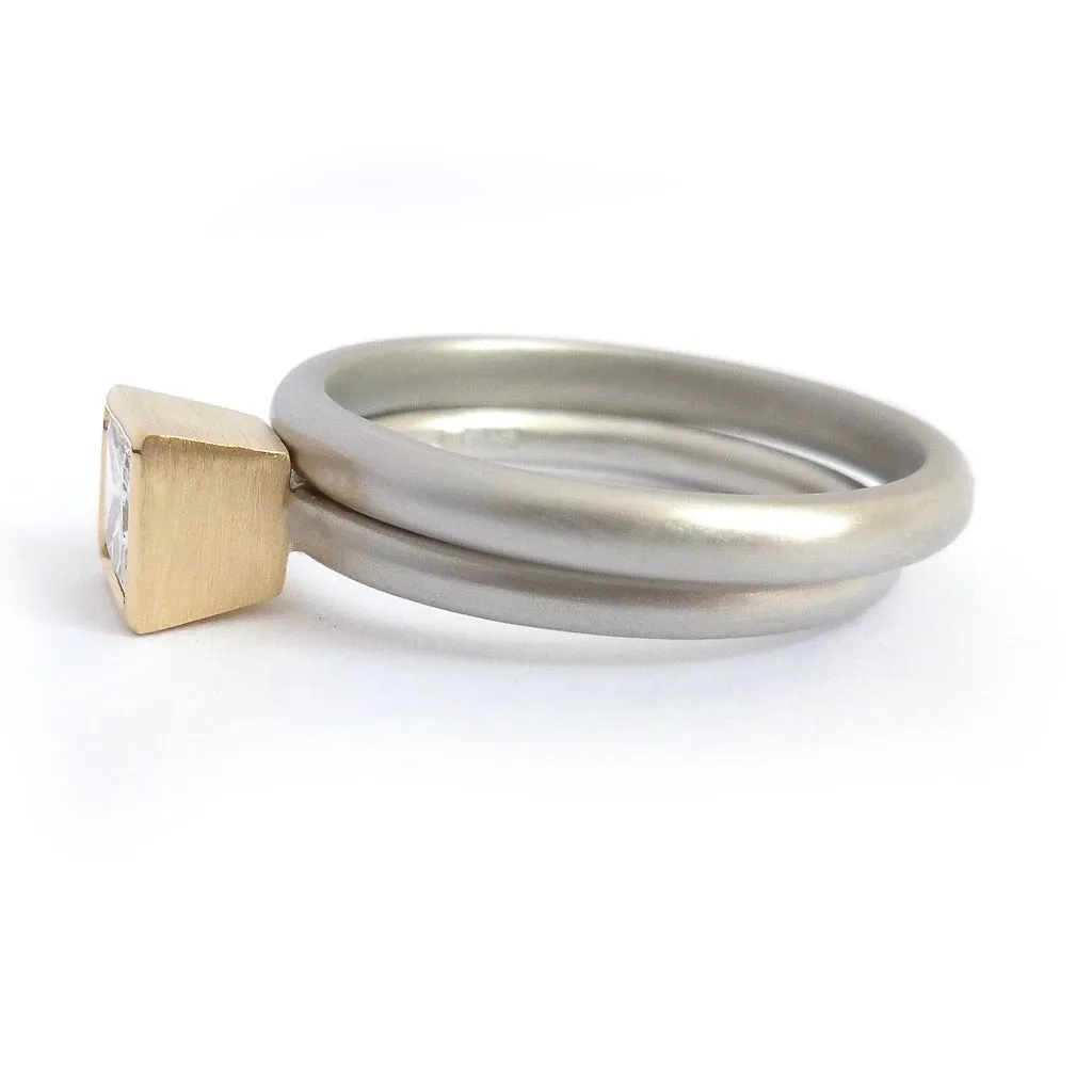 Contemporary platinum and diamond ring