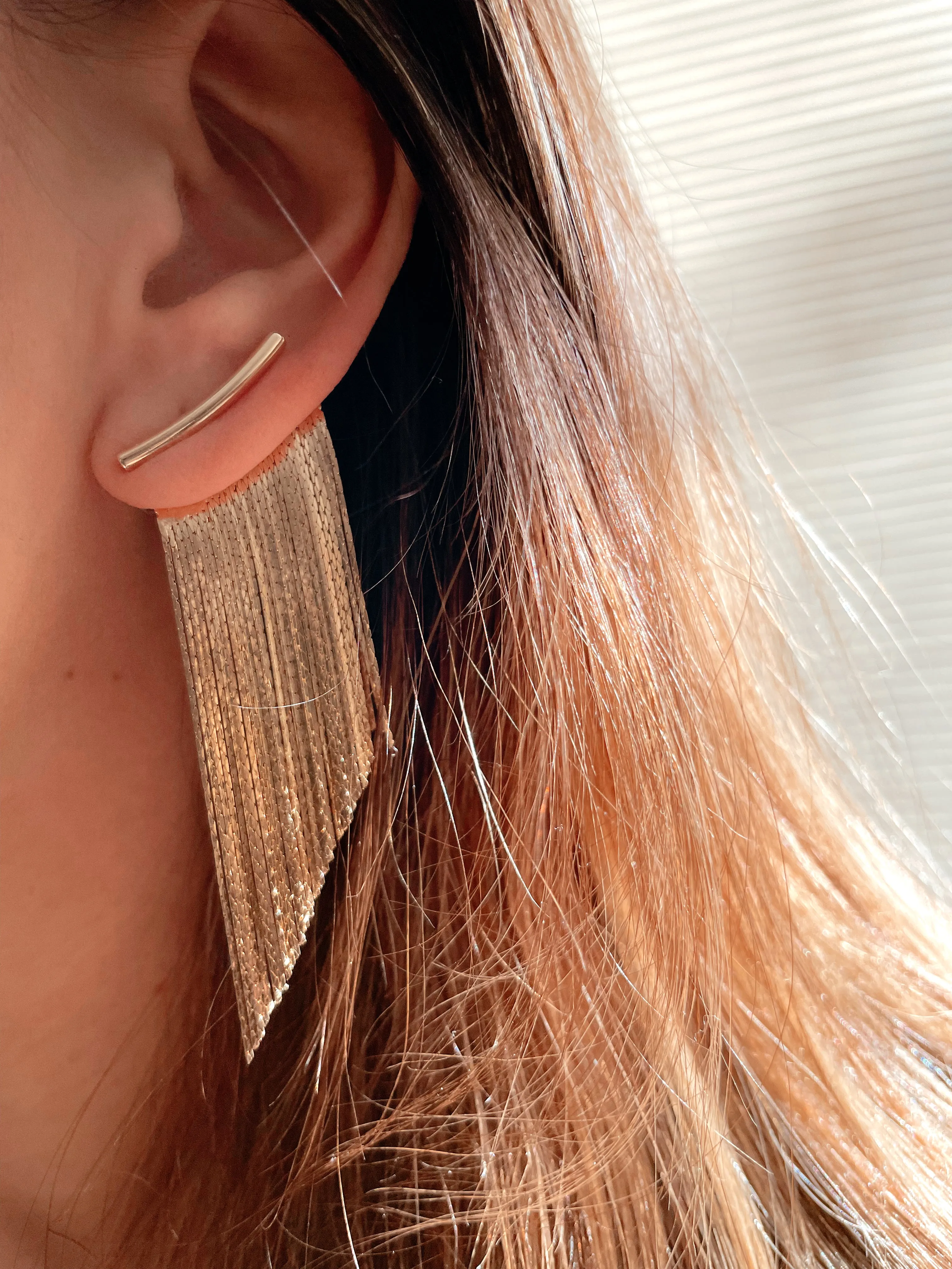 Golden tassel statement earrings
